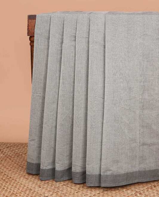 Grey plain Mangalagiri cotton saree, contrast dark grey border, plain pallu, and a contrast kalamkari floral printed blouse