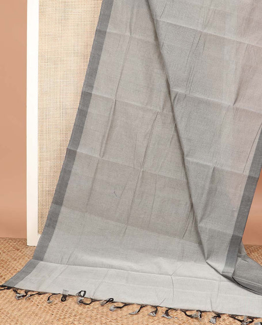 Grey plain Mangalagiri cotton saree, contrast dark grey border, plain pallu, and a contrast kalamkari floral printed blouse