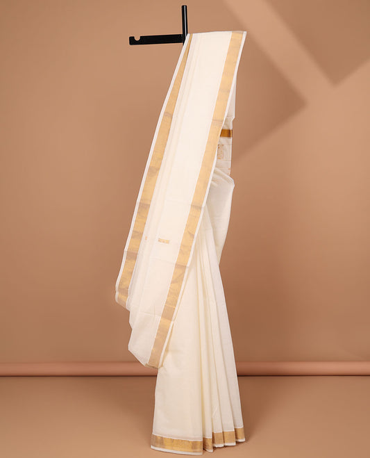 Cream kerala saree, zari border & pallu of peacock zari designs