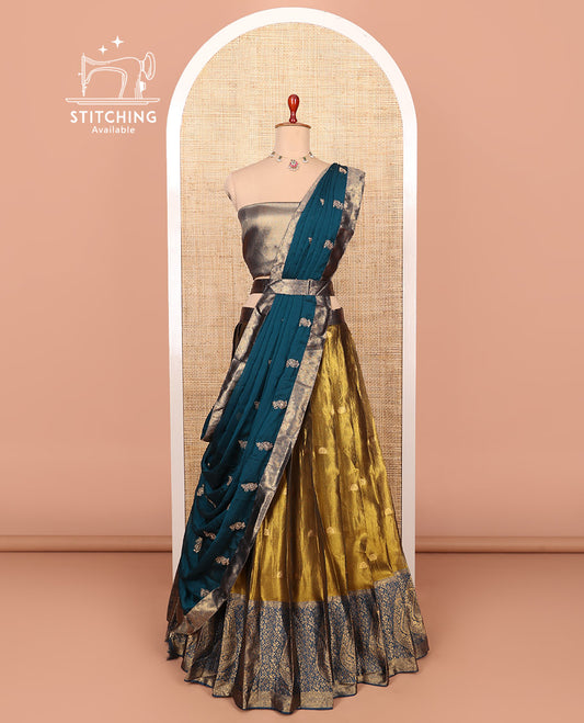 Gold-peacock blue zari buttas half-saree with contrast intricate motifs woven bordered skirt, brocade blouse, and a zari design dhavani