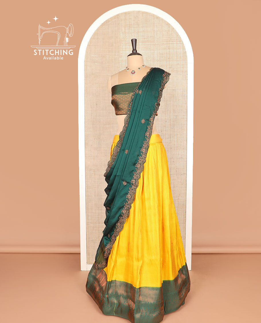 Yellow art silk half-saree, checked with contrast traditional zari bordered skirt, jacquard blouse, and scallop embroidered dhavani