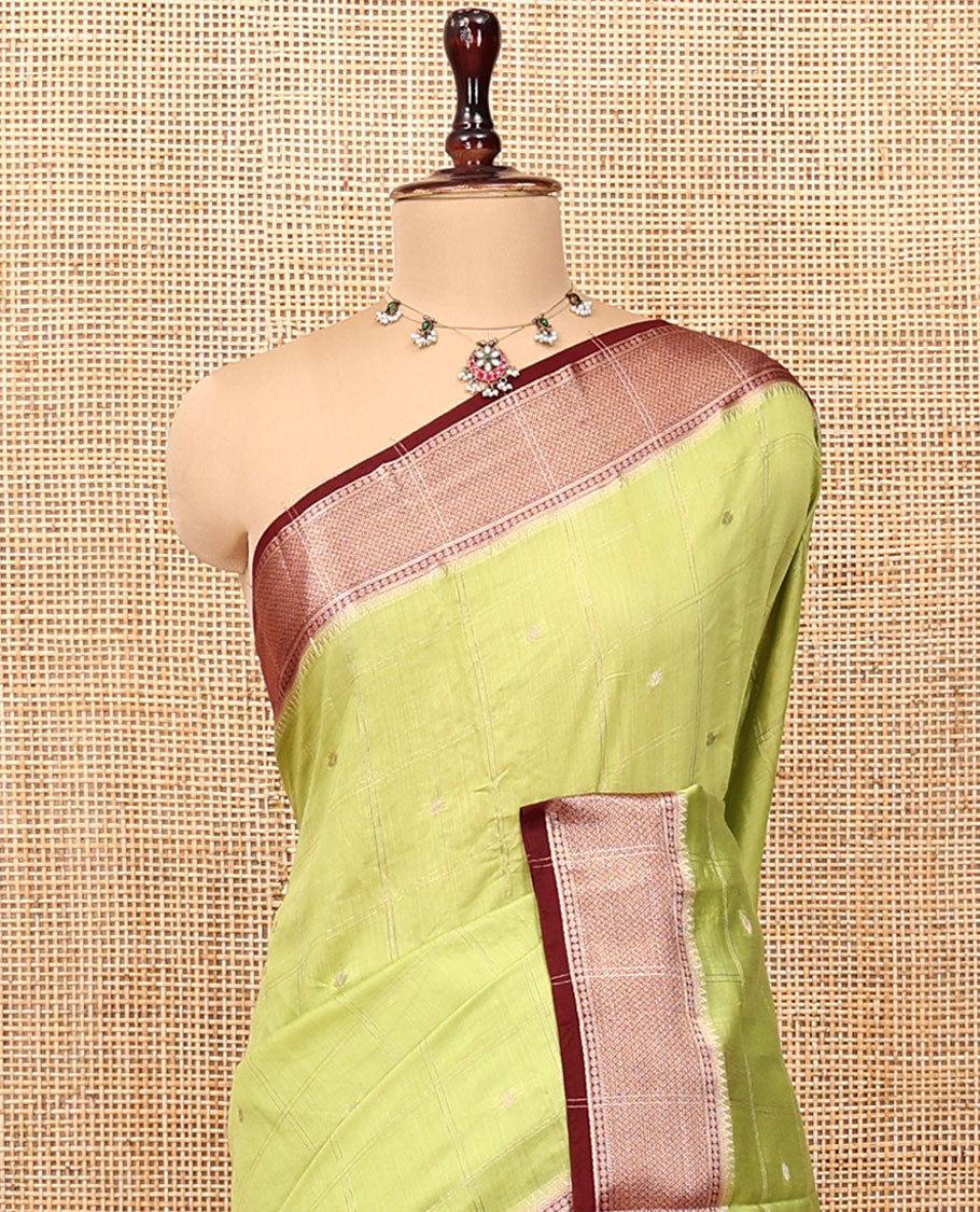 Green Assam Silk Saree, Adorned with Butta Enclosed Checks, Complemented by Contrast Traditional Zari Border, Gleaming Pallu, and Contrast Blouse