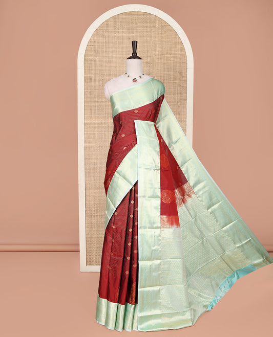 Red Budget Silk Saree, Mesmerized with Zari Buttas and Stripes All Over Its Body, Complemented by a Contrast Traditional Zari Design Border, Sparsely Woven Jaal Pallu, and Paired with a Contrast Blouse