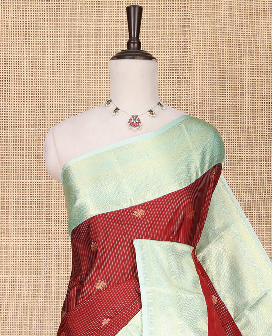 Red Budget Silk Saree, Mesmerized with Zari Buttas and Stripes All Over Its Body, Complemented by a Contrast Traditional Zari Design Border, Sparsely Woven Jaal Pallu, and Paired with a Contrast Blouse