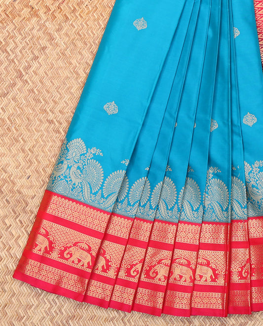 Blue Budget Silk Saree, Adorned with Zari Buttas All Over Its Body, Complemented by a Contrast Traditional Border of Elephant Motifs, Grand Jaal Pallu, and Paired with a Contrast Blouse