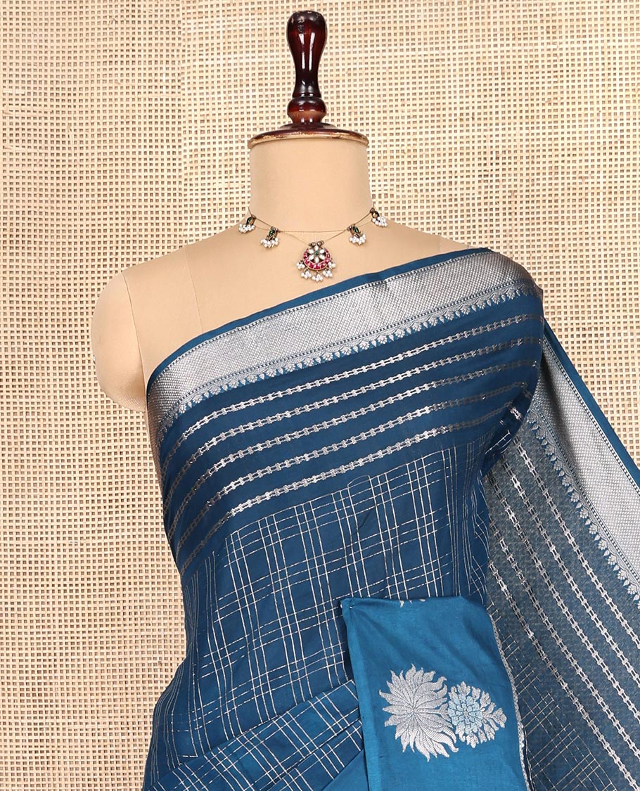 Blue Assam Silk Saree, Gleamed Up with Zari Checks, Highlighted by a Traditional Zari Border, Floral Butta Enclosed Checks Pallu, and a Matching Blouse
