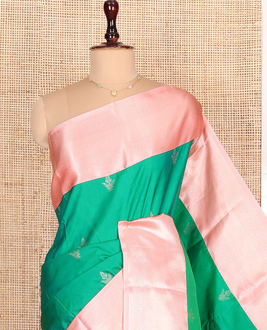 Green Budget Silk Saree, Adorned with Zari Buttas All Over Its Body, Complemented by a Contrast Border of Traditional Zari Designs, Pallu Elevated with Chevron Designs, and Paired with a Contrast Blouse