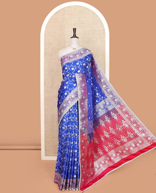 Ultramarine blue floral jaal jacquard banarasi silk saree, contrast lace zari border of floral creeper designs, and pallu of Mughal-style intricate motifs