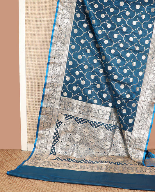 Blue floral jaal jacquard banarasi silk saree, floral creeper design border, and intricate ogee patterned pallu