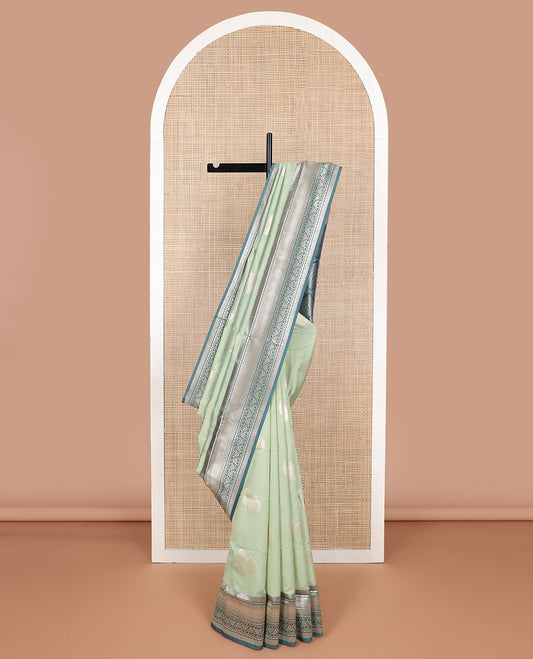 Mint green leaf design butter silk saree with contrast traditional zari design border & argyle design pallu