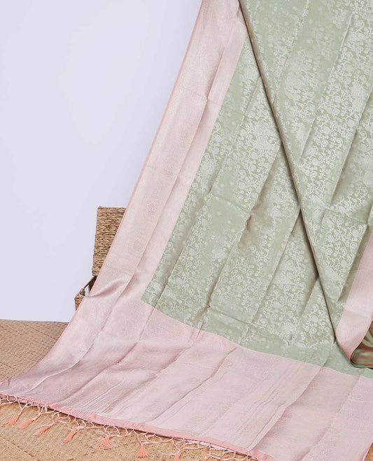Green floral butter silk saree with contrast floral design border & pallu of floral jaal design