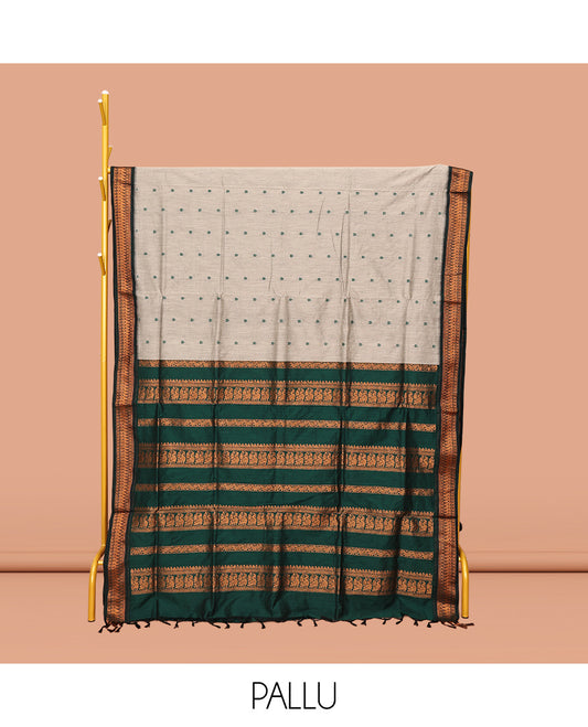 Grey Kalyani Cotton Saree, Delicately Woven with Thread Buttas All Over Its Body, Complemented by a Contrast Traditional Zari Design Border, Pallu Steeped with Peacock Designs, and Paired with a Contrast Blouse