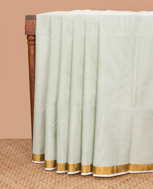 Pale green plain jute cotton saree, zari bavanji border, and striped pallu