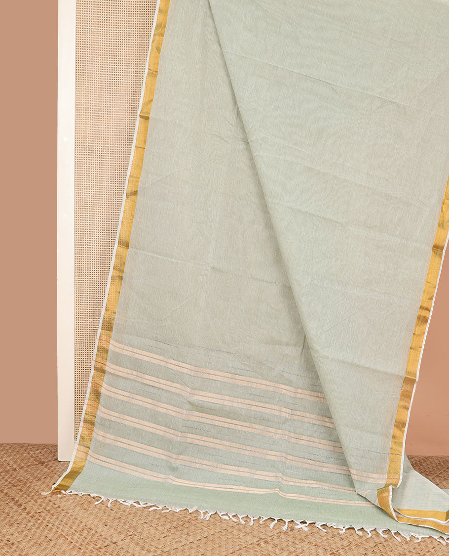 Pale green plain jute cotton saree, zari bavanji border, and striped pallu