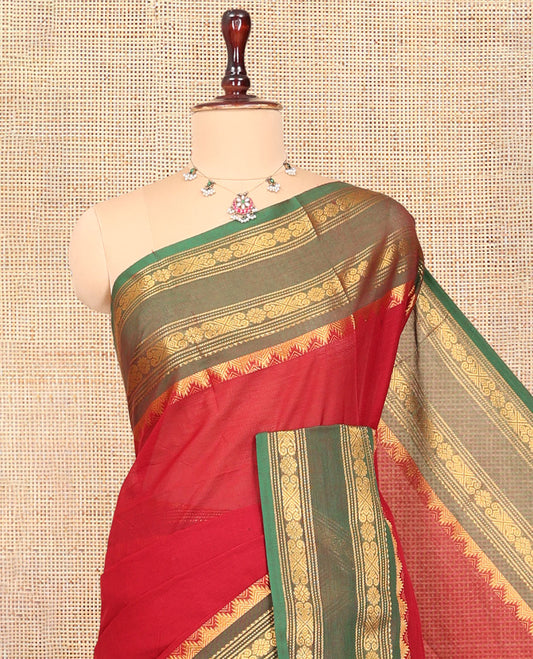 Red Plain Chettinad Cotton Saree, Complemented by a Contrast Rettai Pettu Traditional Temple Border, a Striped Pallu, and a Matching Blouse