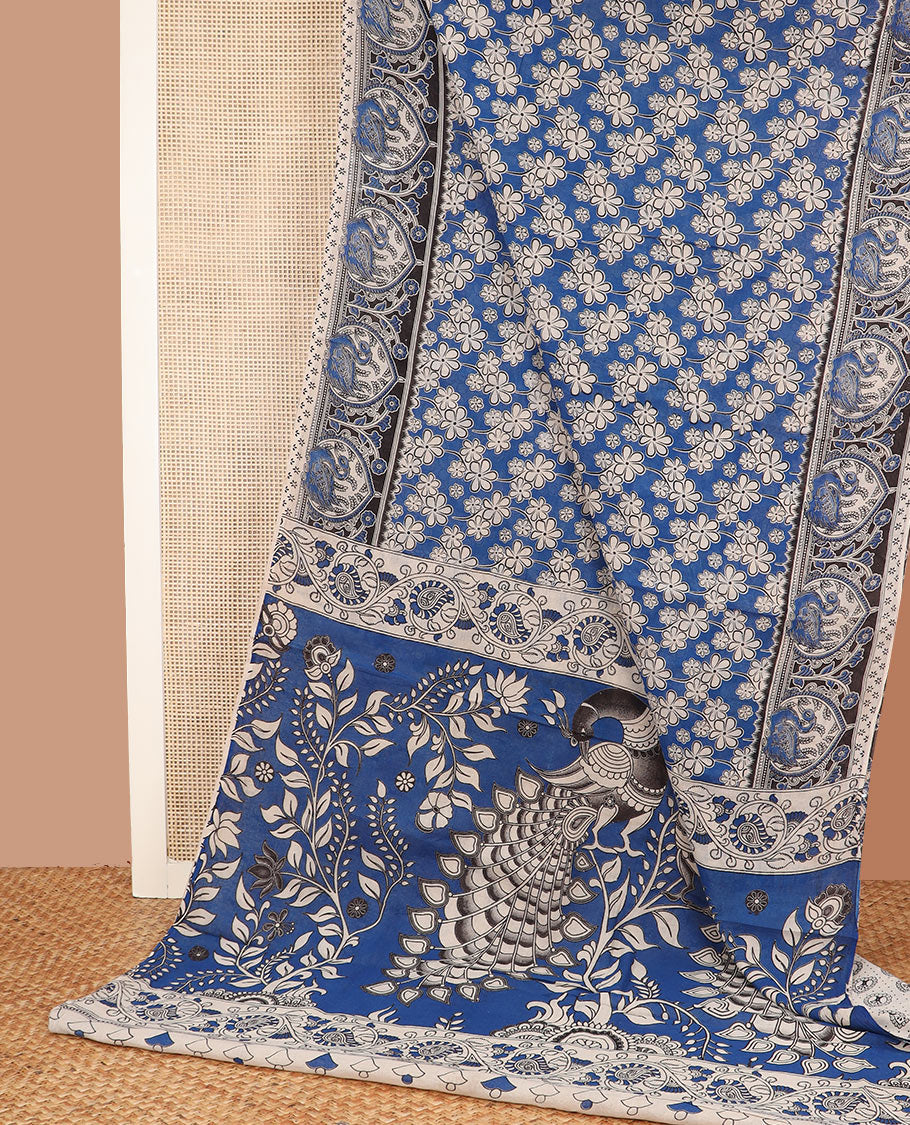 Blue floral motifs machine-printed kalamkari cotton saree, contrast bird motifs printed border, and pallu of kalamkari peacock motifs