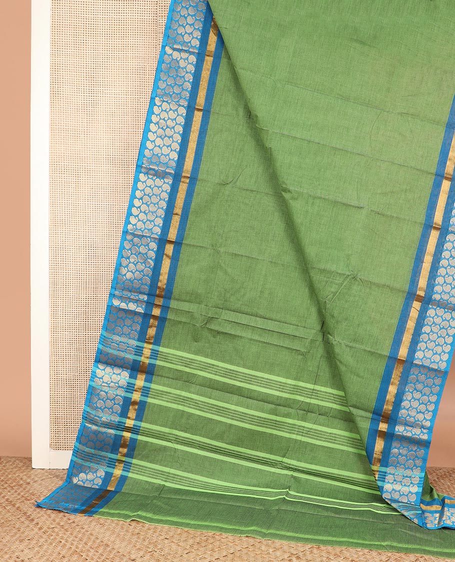Green plain Chettinad cotton saree, contrast zari border steeped with paisleys, and striped pallu