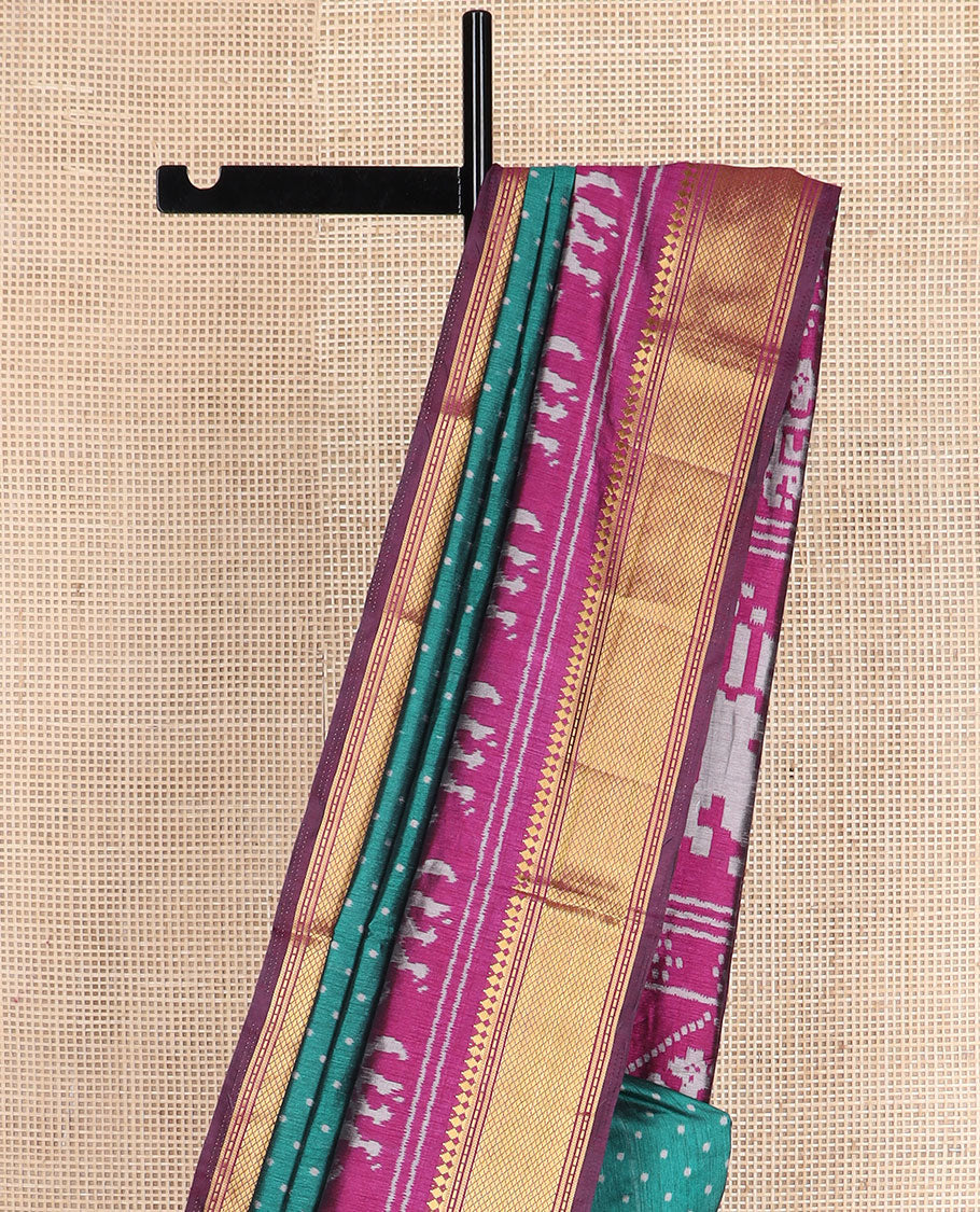 Green buttas semi-banaras patola silk saree, contrast elephant motifs border of traditional zari designs, and pallu of elephant motifs