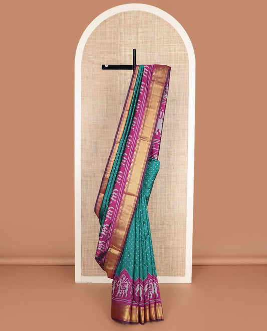 Green buttas semi-banaras patola silk saree, contrast elephant motifs border of traditional zari designs, and pallu of elephant motifs