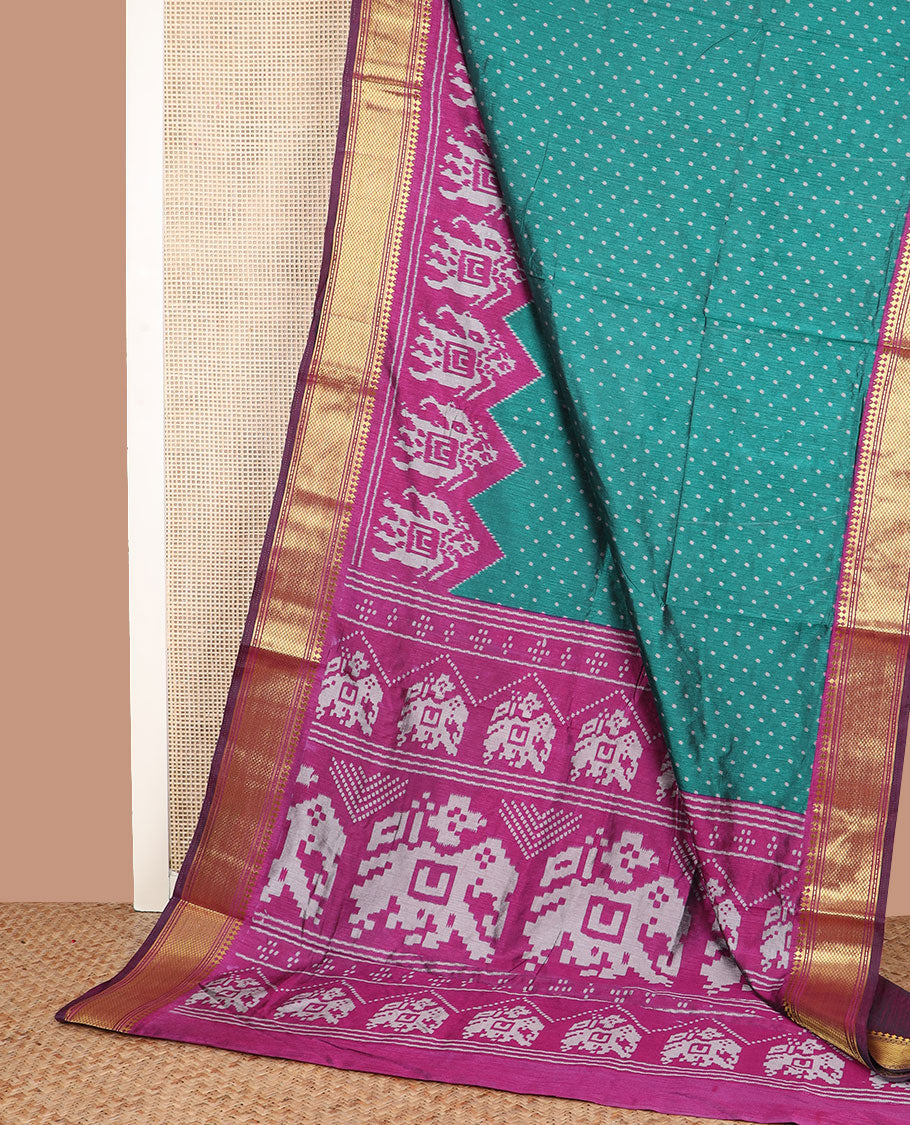 Green buttas semi-banaras patola silk saree, contrast elephant motifs border of traditional zari designs, and pallu of elephant motifs