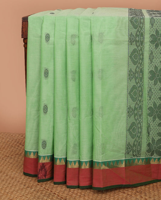 Green circle motifs kanchi cotton saree, contrast zari temple border of peacock designs & floral design pallu