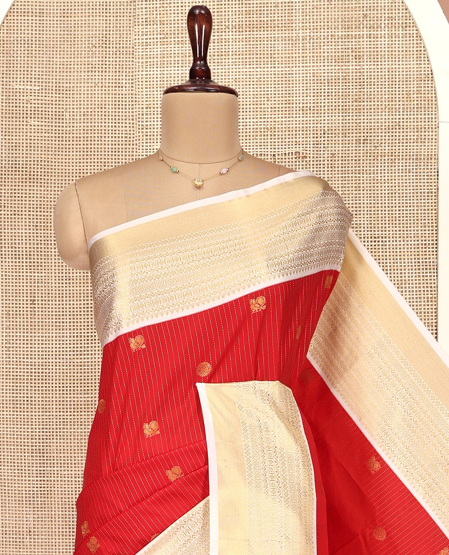 Rust Orange and Off-White Budget Silk Saree, Accentuated with Vaira Oosi, and Mayil-Chakram Designs on Its Body, Complemented by Contrast Traditional Zari Design Border, Chevron-Striped Pallu, and Paired with a Contrast Blouse