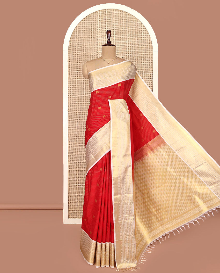 Rust Orange and Off-White Budget Silk Saree, Accentuated with Vaira Oosi, and Mayil-Chakram Designs on Its Body, Complemented by Contrast Traditional Zari Design Border, Chevron-Striped Pallu, and Paired with a Contrast Blouse
