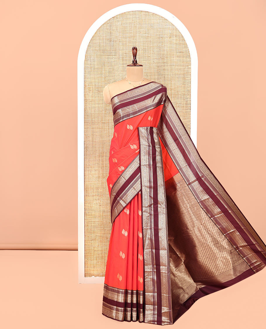 Orange and Brown Budget Silk Saree, Enriched with Leaf Zari Buttas All Over Its Body, Complemented by Contrast Rettai Pettu Traditional Zari Designs Woven Border, Grand Jaal Pallu, and Paired with a Contrast Blouse