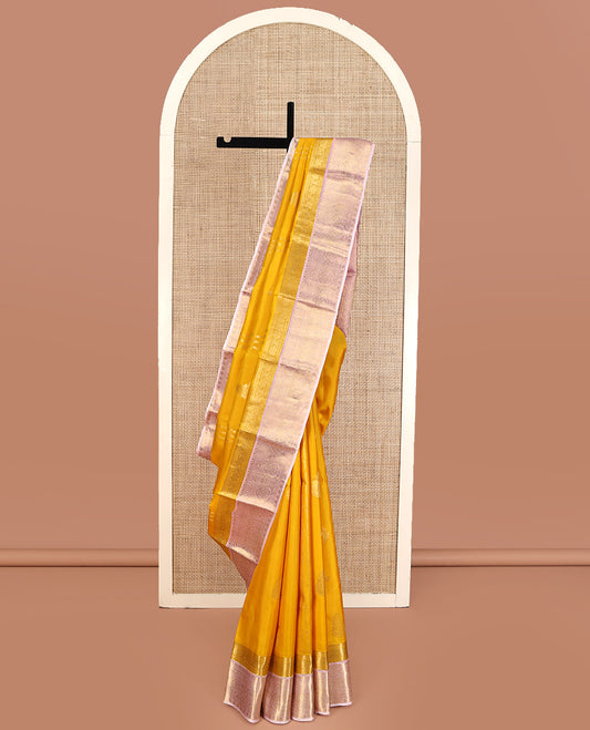 Mustard Yellow-Beach Pink Vasundhara Silk Saree, Richly Detailed with Zari Buttas, Complemented by Contrast Border of Kamalam, Muthu, Cross Kamalam, Rudraksham, and Thilakam Design, Pallu Steeped with Thilakam Designs, and Paired with a Contrast Blouse