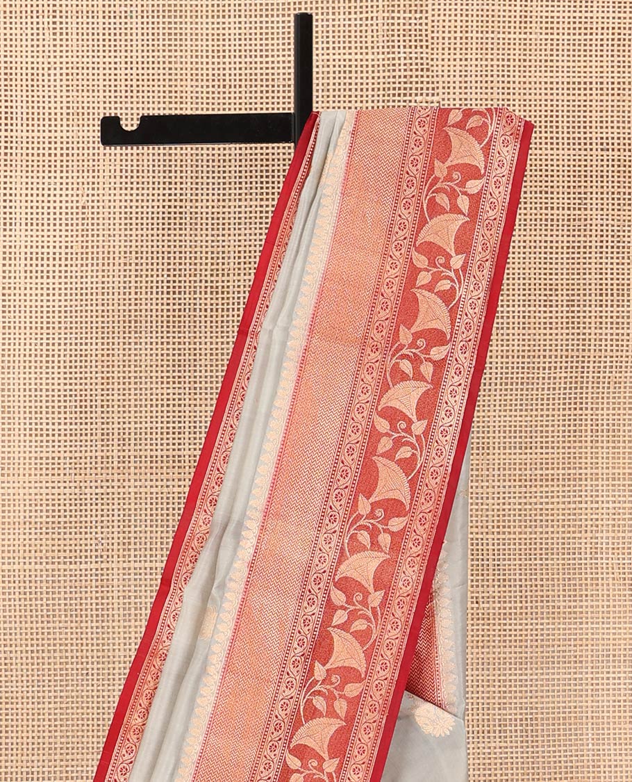 Grey Raw Mango Silk Saree Adorned with Buttas, Complemented by a Contrast Traditional Zari-Designed Border, Featuring a Zari-Elevated Jaal-Designed Pallu, Paired with a Contrast Blouse
