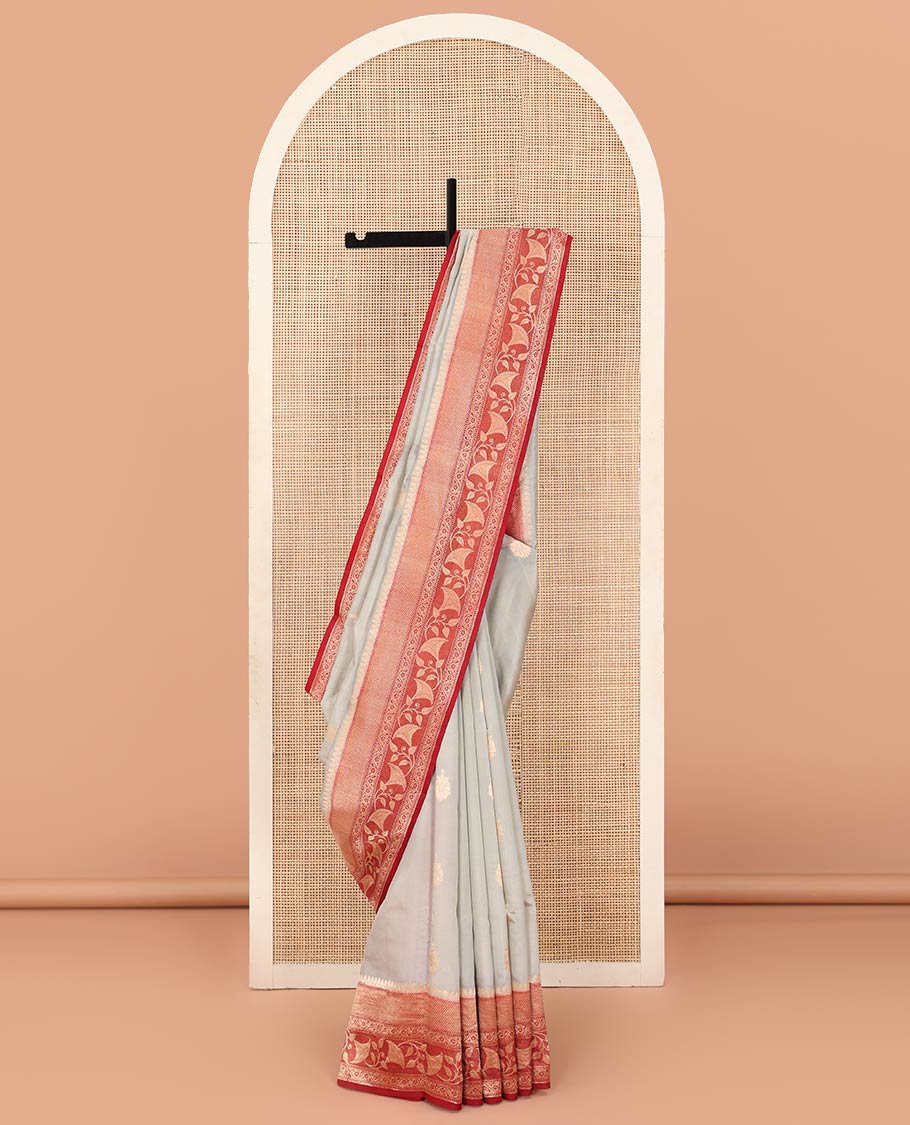 Grey Raw Mango Silk Saree Adorned with Buttas, Complemented by a Contrast Traditional Zari-Designed Border, Featuring a Zari-Elevated Jaal-Designed Pallu, Paired with a Contrast Blouse