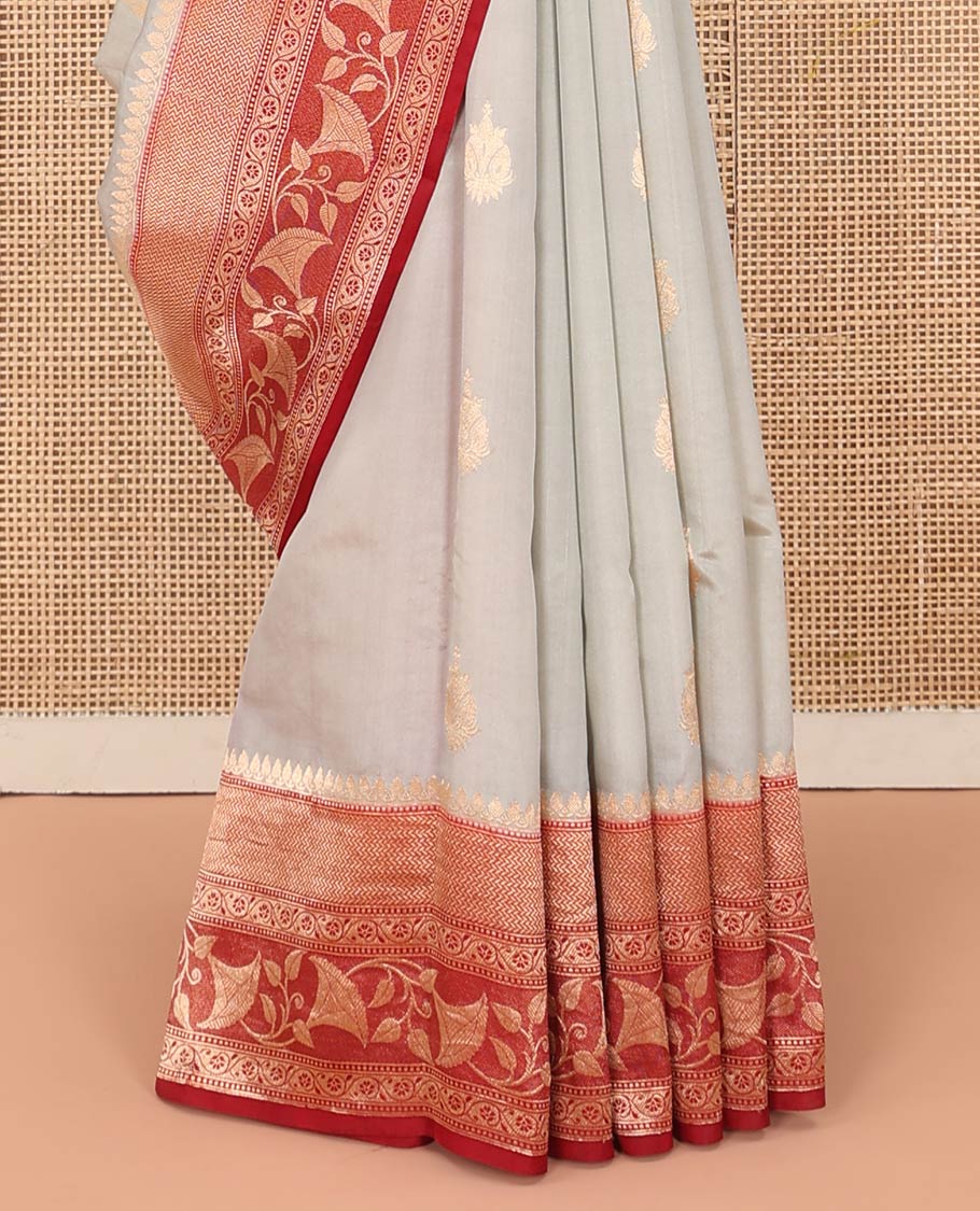 Grey Raw Mango Silk Saree Adorned with Buttas, Complemented by a Contrast Traditional Zari-Designed Border, Featuring a Zari-Elevated Jaal-Designed Pallu, Paired with a Contrast Blouse