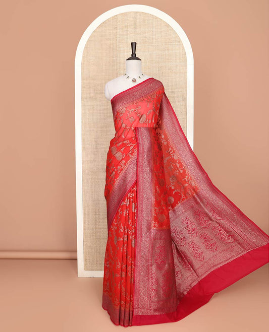 Red Fancy Georgette Saree Gracefully Embellished with Floral Jaal Jacquard Design, Highlighted by Zari Border of Paisleys, Zari Woven Pallu Featuring Floral Designs in Zari, and Paired with a Matching Blouse