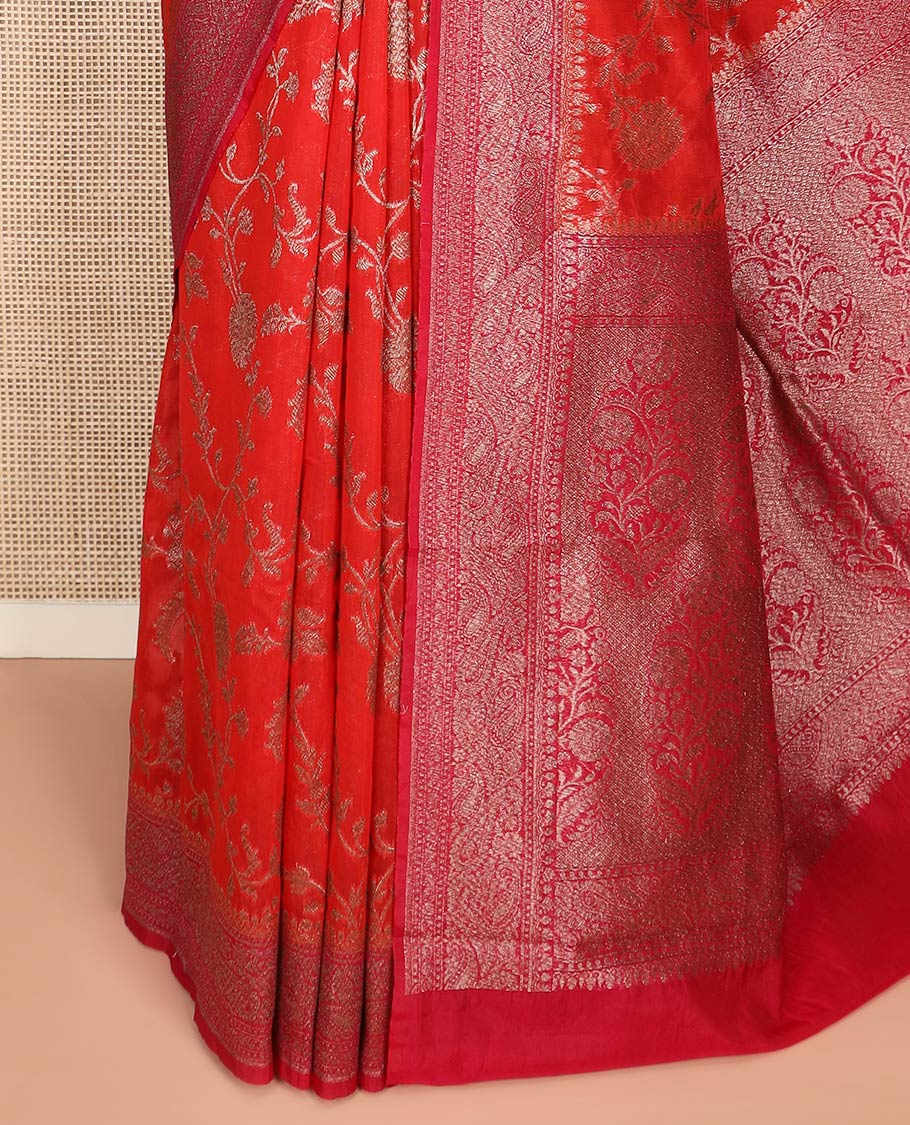 Red Fancy Georgette Saree Gracefully Embellished with Floral Jaal Jacquard Design, Highlighted by Zari Border of Paisleys, Zari Woven Pallu Featuring Floral Designs in Zari, and Paired with a Matching Blouse