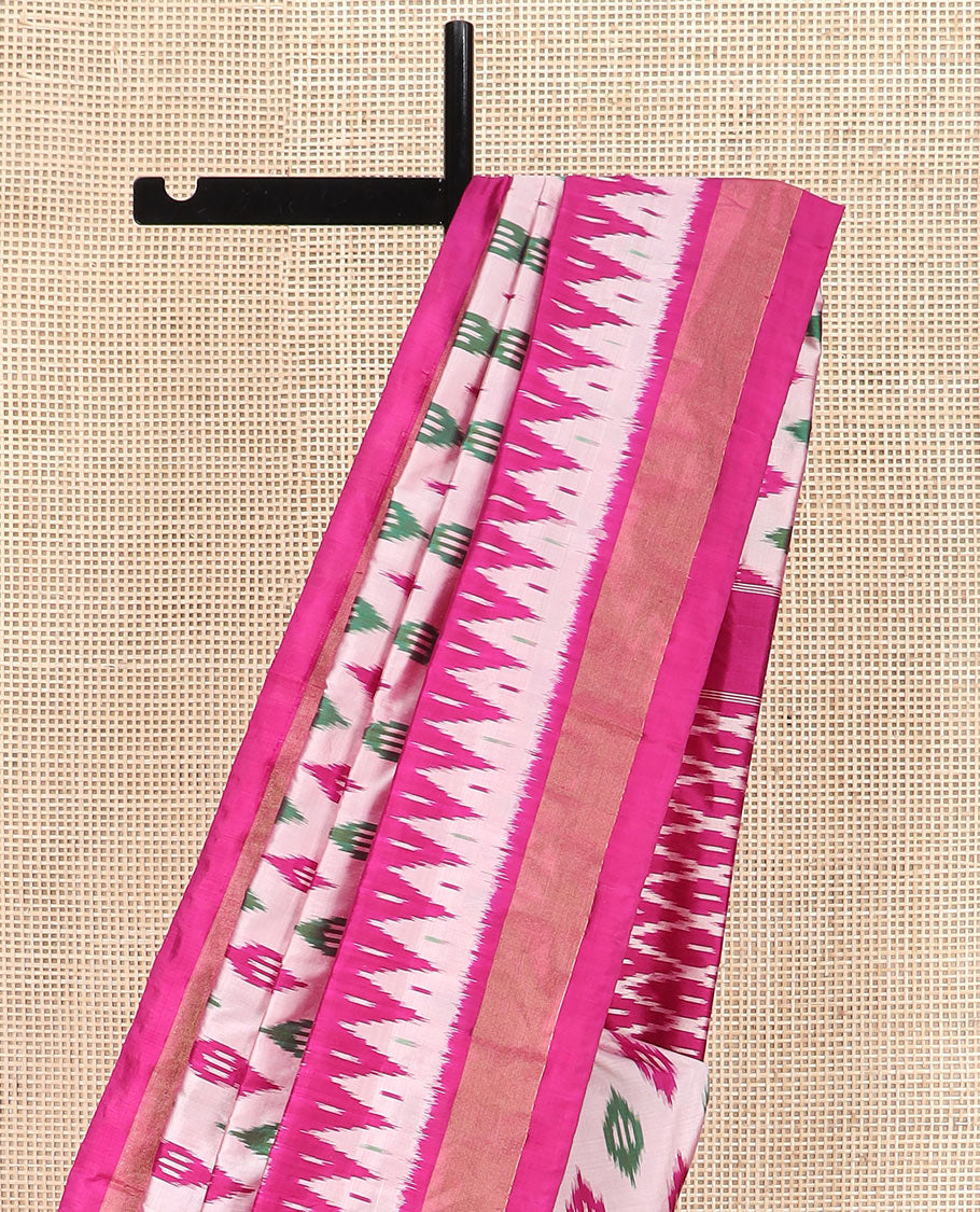 Pink Ikkat Silk Saree Highlighted with Diamond-Shaped Ikkat Buttas, Featuring a Contrast Ikkat Temple Border and a Pallu Showcasing an Ikkat-Textured Jaal Design, Paired with a Contrast Blouse