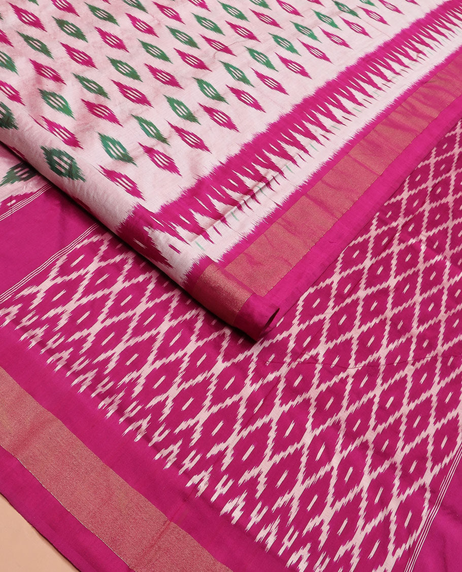 Pink Ikkat Silk Saree Highlighted with Diamond-Shaped Ikkat Buttas, Featuring a Contrast Ikkat Temple Border and a Pallu Showcasing an Ikkat-Textured Jaal Design, Paired with a Contrast Blouse