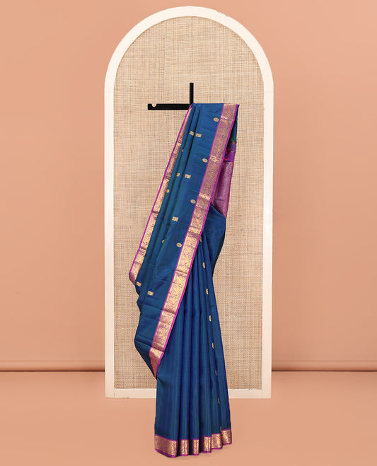Blue Kanchipuram Silk Saree, Artfully Woven with Mayil Chakram Buttas All Over Its Body, Complemented by a Contrast Border of Muthu, Kathir, and Mayil Designs, Grand Jaal Pallu, and Paired with a Contrast Blouse