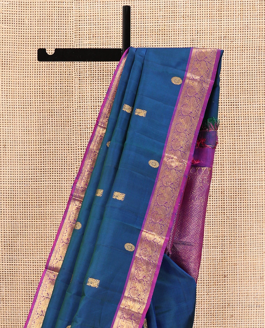 Blue Kanchipuram Silk Saree, Artfully Woven with Mayil Chakram Buttas All Over Its Body, Complemented by a Contrast Border of Muthu, Kathir, and Mayil Designs, Grand Jaal Pallu, and Paired with a Contrast Blouse