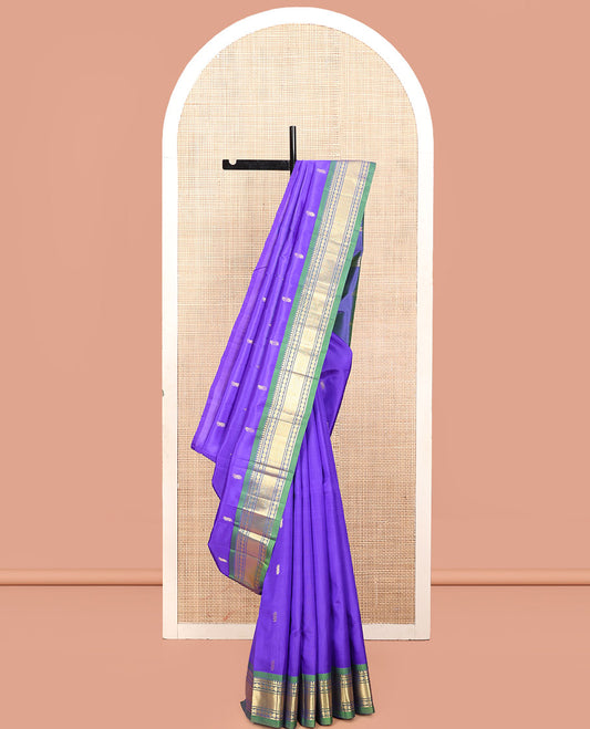 Violet Kanchipuram Silk Saree, Adorned with Zari Buttas, a Contrast One-Sided Border of Rekku, Rudraksham, and Vanki, a Zari-Design Pallu, and No Blouse
