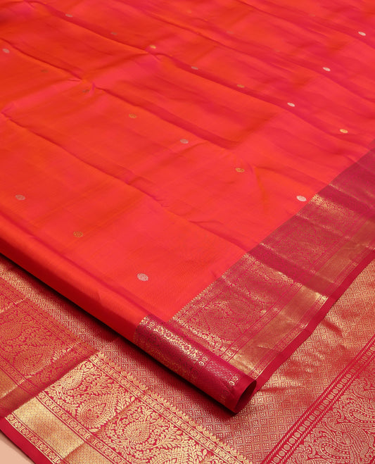 Orange Kanchipuram Silk Saree, Adorned with Zari Buttas All Over Its Body, Complemented by Contrast Border of Kamalam, Thilakam, and Mayil Kann Designs, Grand Jaal Pallu, and Paired with a Contrast Blouse