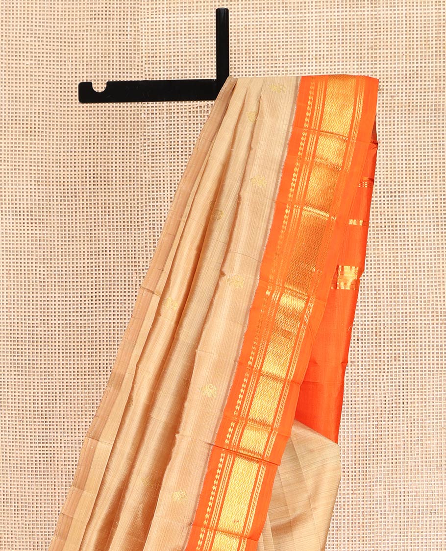 Sandal Kanchipuram Silk Saree, Graced with Zari Buttas on Its Body, Complemented by a Contrast One-Sided Korvai Border of Panner Sombu, Banaras, Muthu, and Mayil Kann Designs, Pallu Steeped with Zari Designs, and Comes Without a Blouse