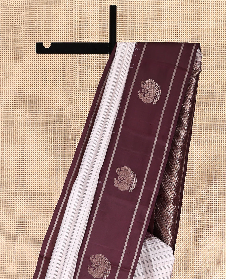 Off-white Kanchipuram Silk Saree, Subtly Sparkled with Checked Design On Its Body, Complemented by Contrast Border of Banaras and Annam Designs, Pallu of Diagonal Rekku Designs, and Paired with a Contrast Blouse