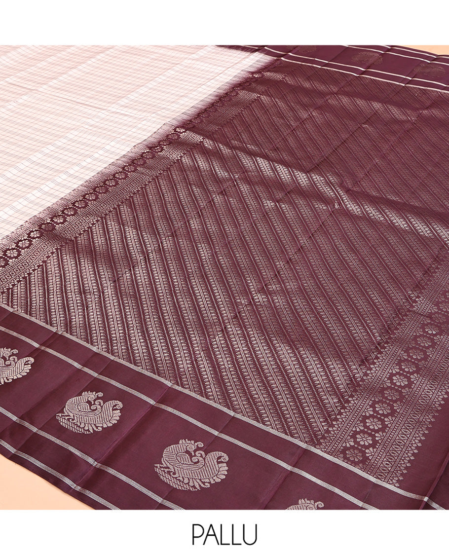 Off-white Kanchipuram Silk Saree, Subtly Sparkled with Checked Design On Its Body, Complemented by Contrast Border of Banaras and Annam Designs, Pallu of Diagonal Rekku Designs, and Paired with a Contrast Blouse