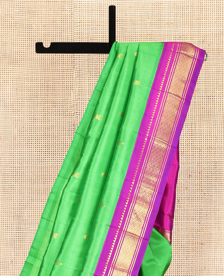 Green Kanchipuram Silk Saree, Adorned with Zari Buttas, Complemented by a Contrast One-Sided Korvai Border of Rekku, Banaras, and Jaal Designs, Zari Design Pallu, and No Blouse