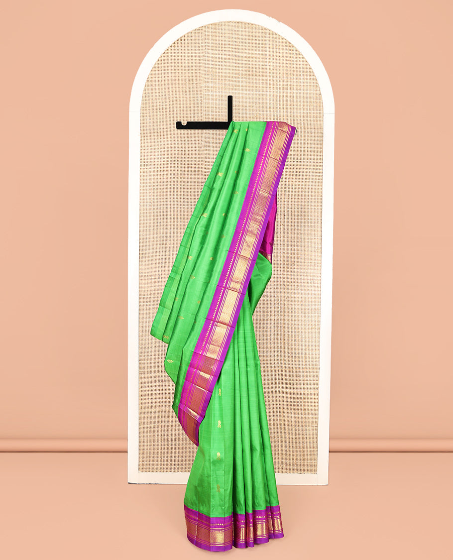Green Kanchipuram Silk Saree, Adorned with Zari Buttas, Complemented by a Contrast One-Sided Korvai Border of Rekku, Banaras, and Jaal Designs, Zari Design Pallu, and No Blouse