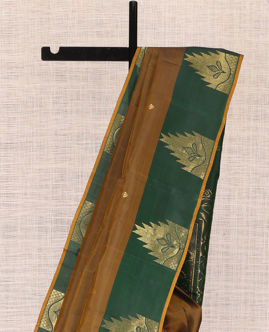 Brown Kanchipuram Silk Saree, Subtly Woven with Buttas, Complemented by a Contrast Thazampoo Rekku Border, Grand Floral Pallu, and Contrast Blouse