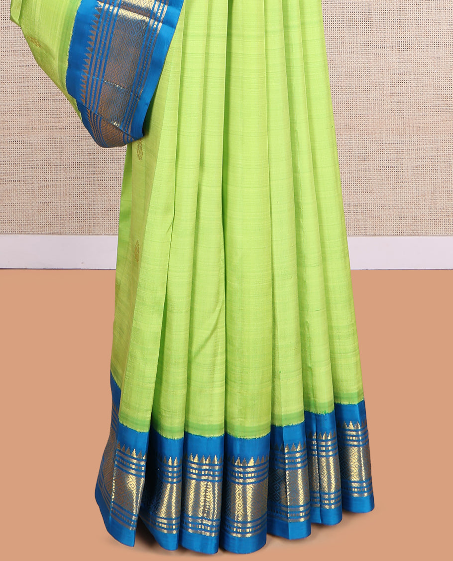Green Kanchipuram Silk Saree, Subtly Woven with Zari Buttas, a Contrast Korvai One-Sided Border of Rekku, Banaras, Muthu, and Mayil Kann Design, Zari Design Pallu, and No Blouse