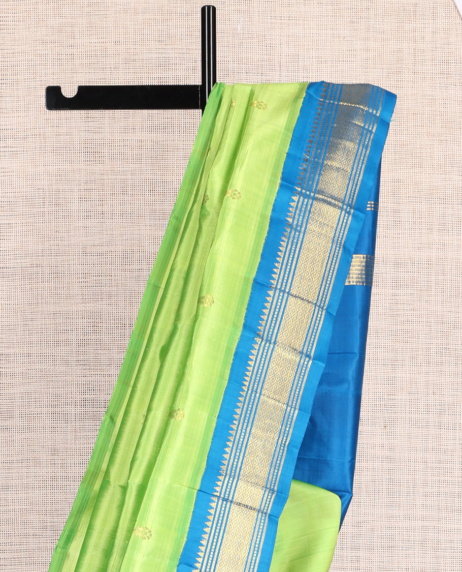 Green Kanchipuram Silk Saree, Subtly Woven with Zari Buttas, a Contrast Korvai One-Sided Border of Rekku, Banaras, Muthu, and Mayil Kann Design, Zari Design Pallu, and No Blouse