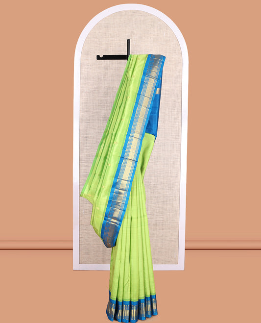 Green Kanchipuram Silk Saree, Subtly Woven with Zari Buttas, a Contrast Korvai One-Sided Border of Rekku, Banaras, Muthu, and Mayil Kann Design, Zari Design Pallu, and No Blouse