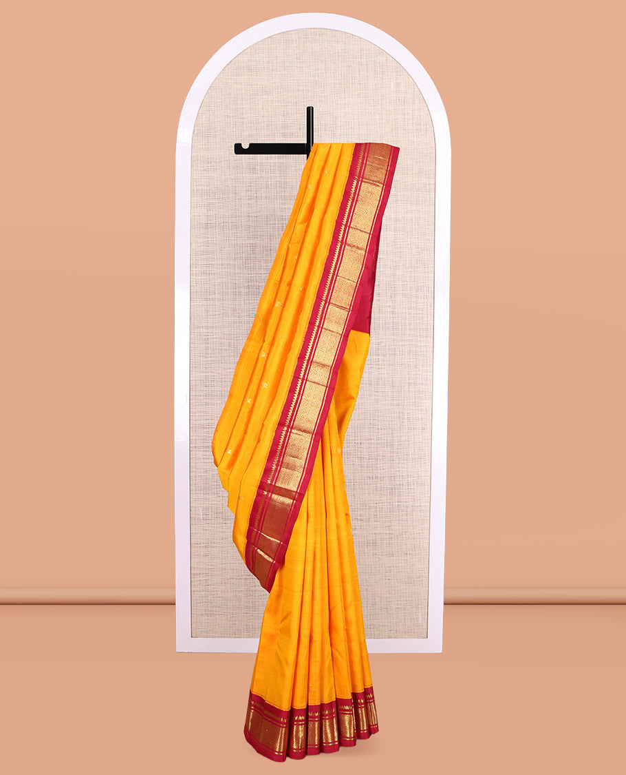 Orange Kanchipuram Silk Saree, Adorned with Zari Buttas, a Contrast Korvai One-Sided Border of Thilakam Mokku, Banaras, and Jaal Designs, Zari Design Pallu, and No Blouse